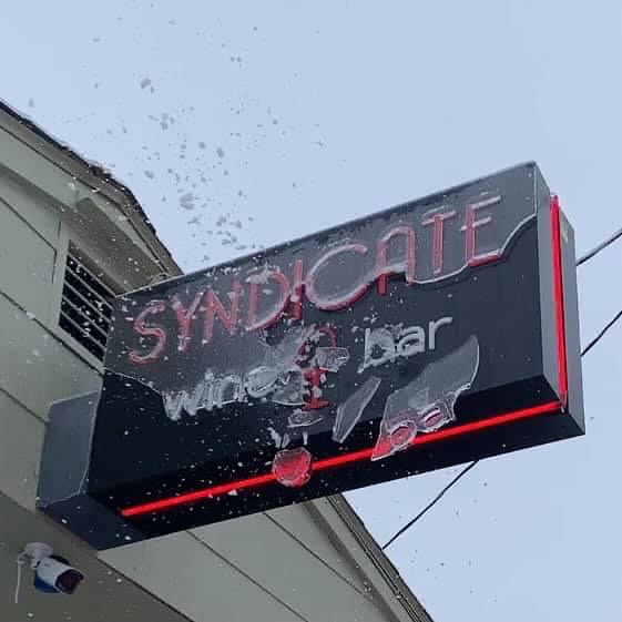 cracked ice on the syndicate wine bar sign